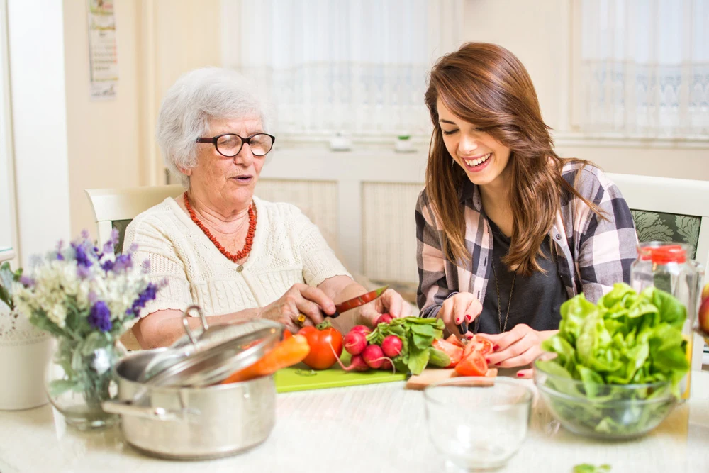 Home health aid provides senior care services for elderly woman