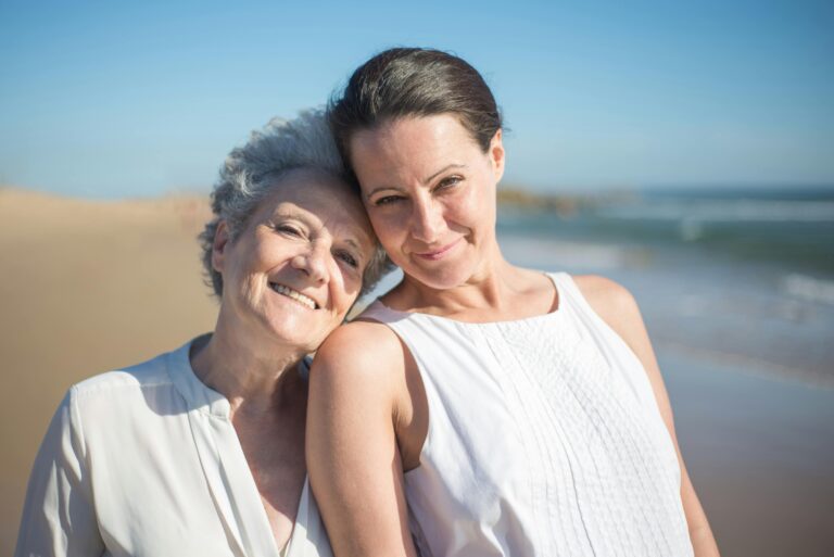 elderly mother and daughter on a beach for vacation