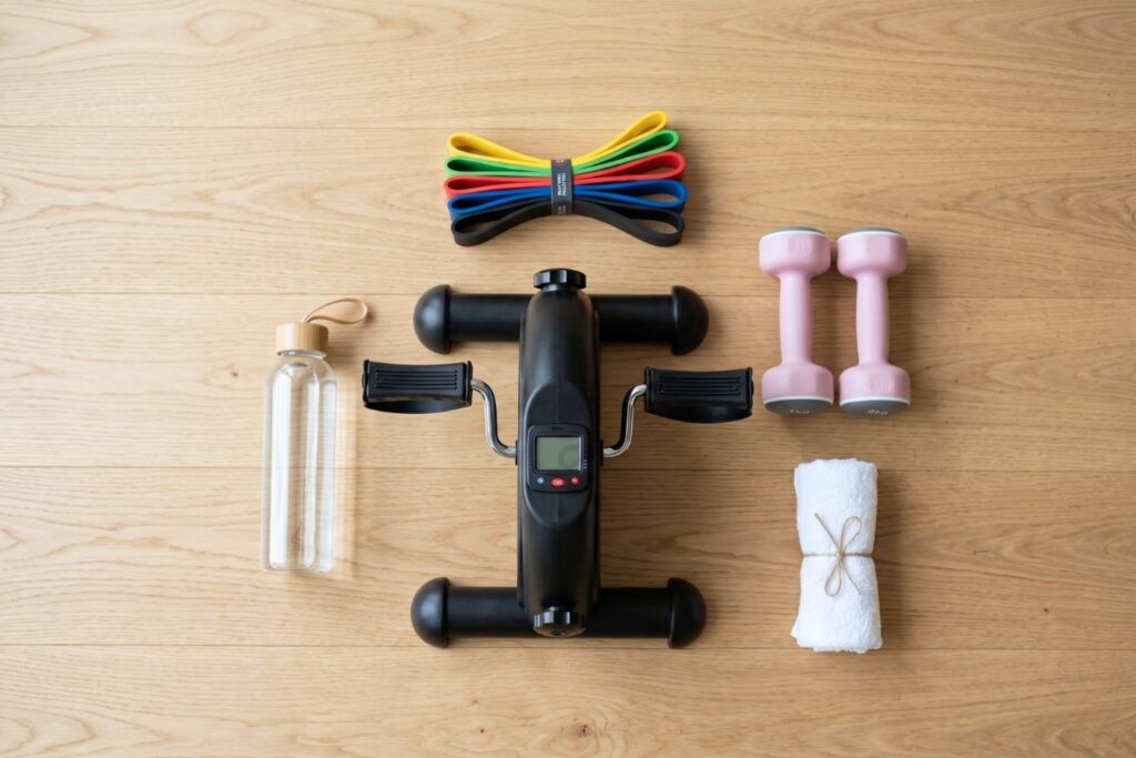 Home exercise bike on the floor with other workout equipment
