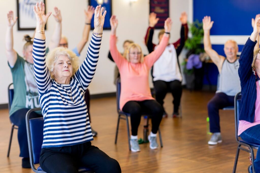 Group of women doing home workouts for seniors