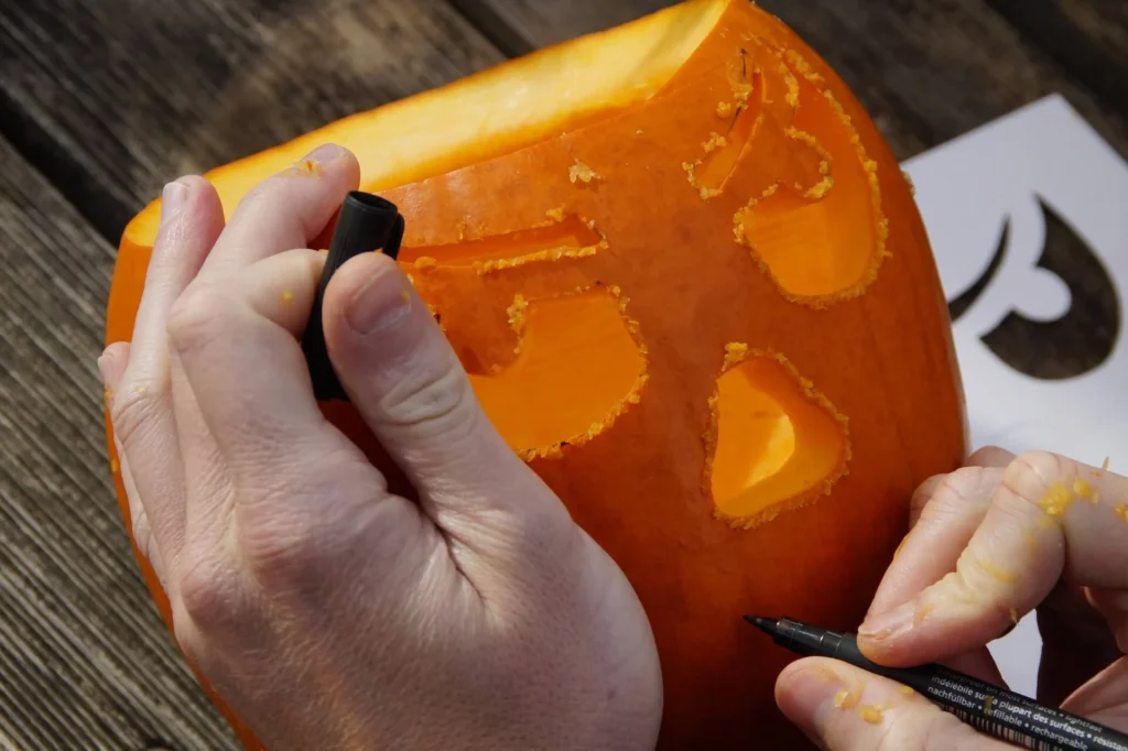 Man carving a pumpkin as a Halloween activity for seniors